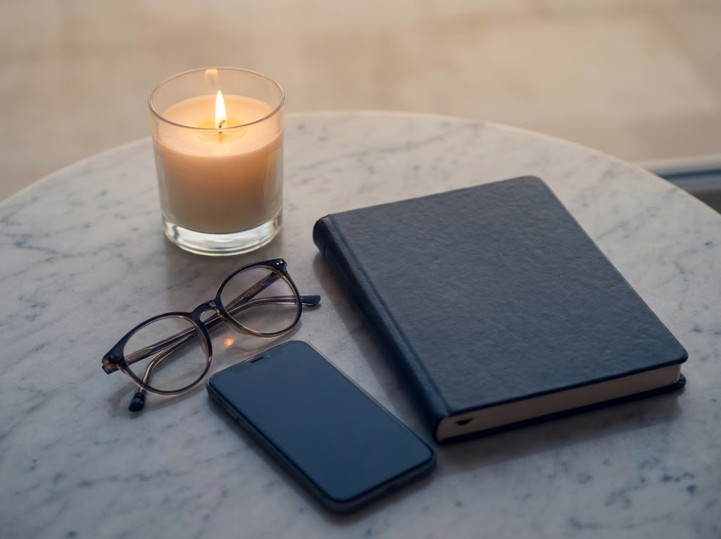 Notebook and phone on a table, ready for a call